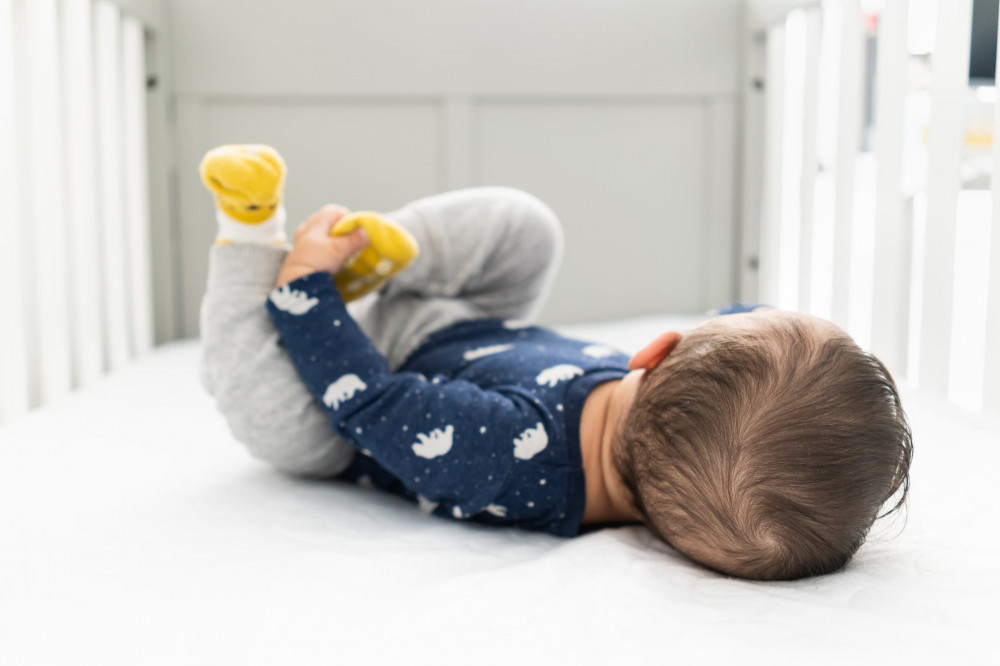 Should my 1 year old sleep with socks?