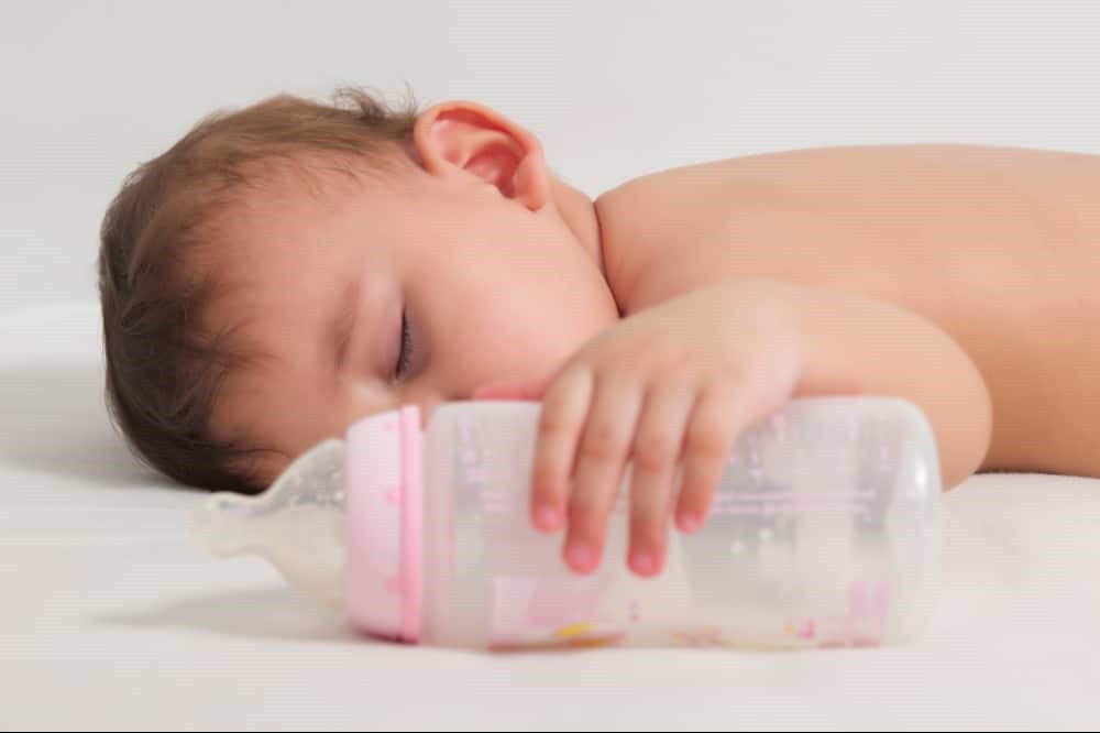 When should I stop giving my toddler milk before bed?