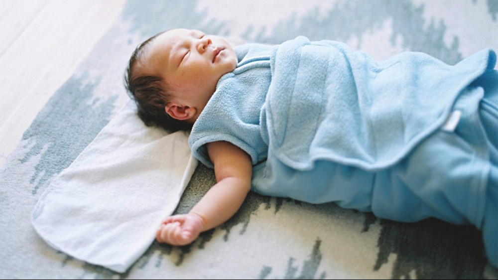 Baby won't sleep without a swaddle but rolls over